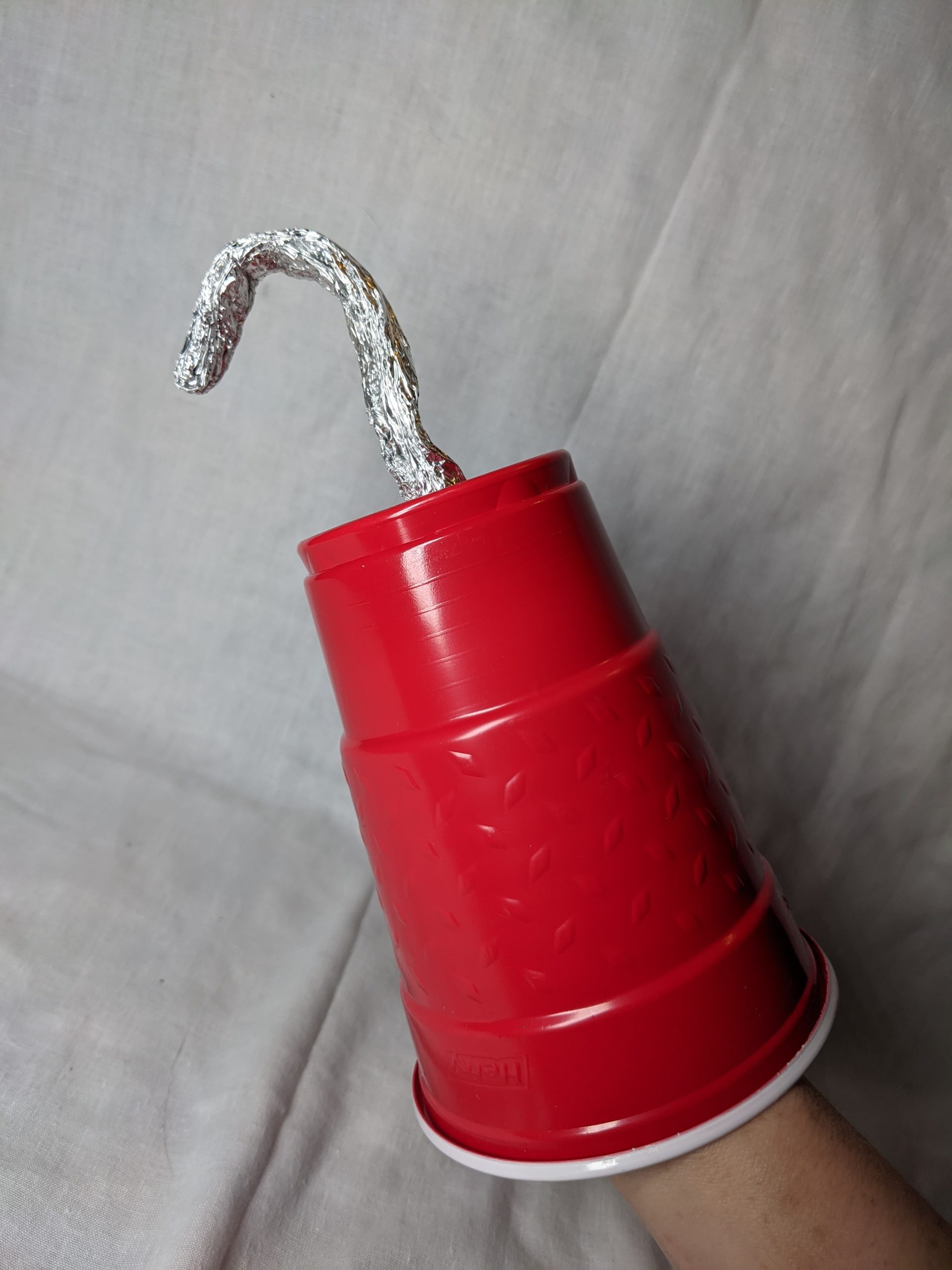 a pirate hook made from a cup and foil